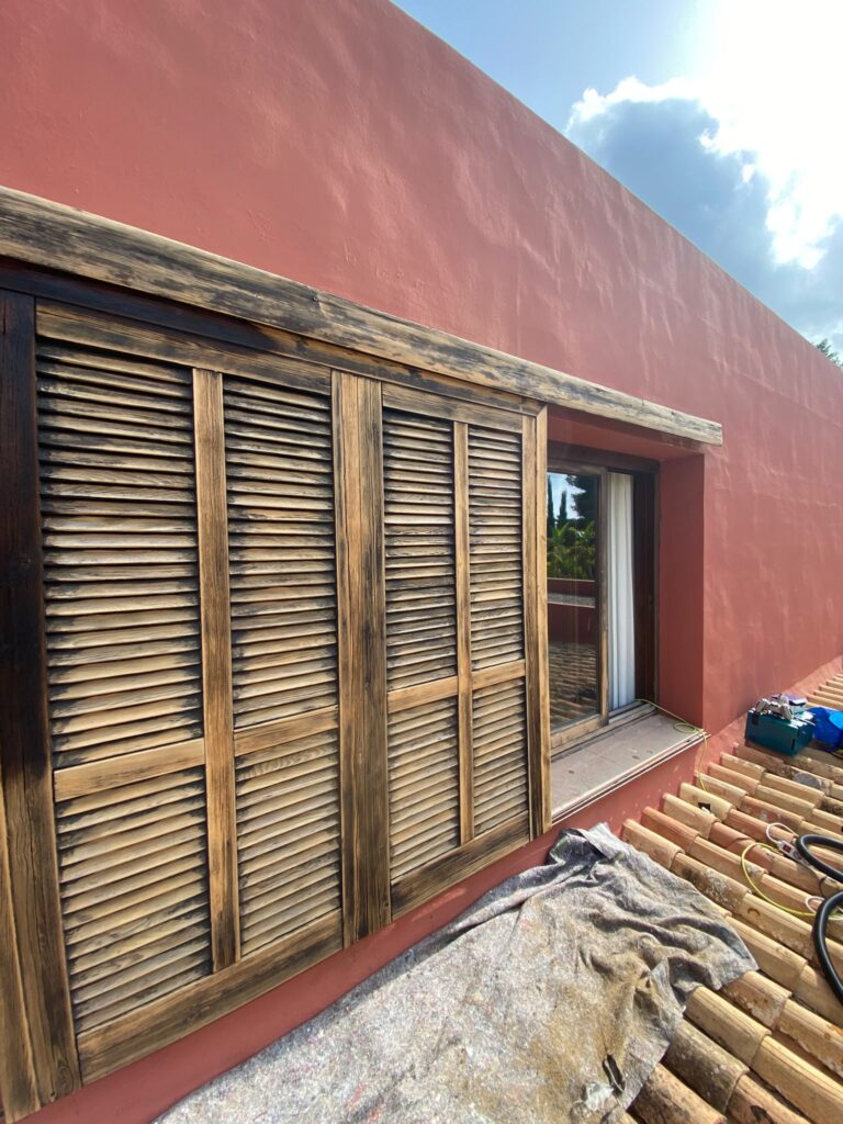 Restored wooden window and shutters