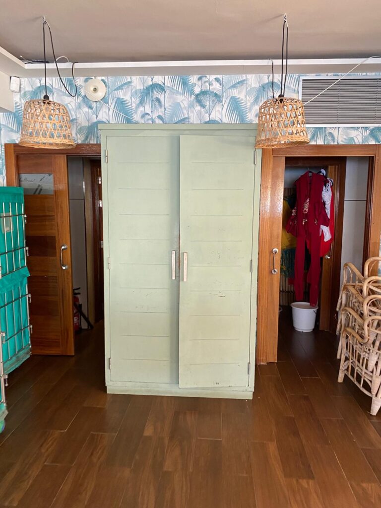 Painted green wardrobe before restoration