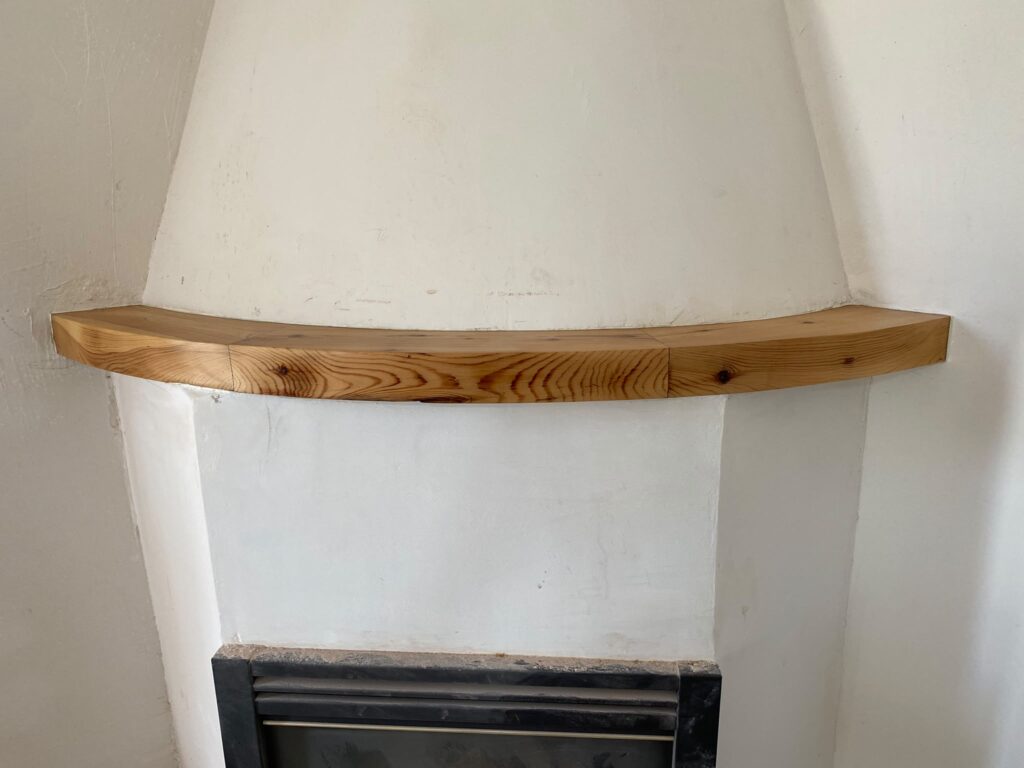 Restored timber piece above a fireplace in Calpe