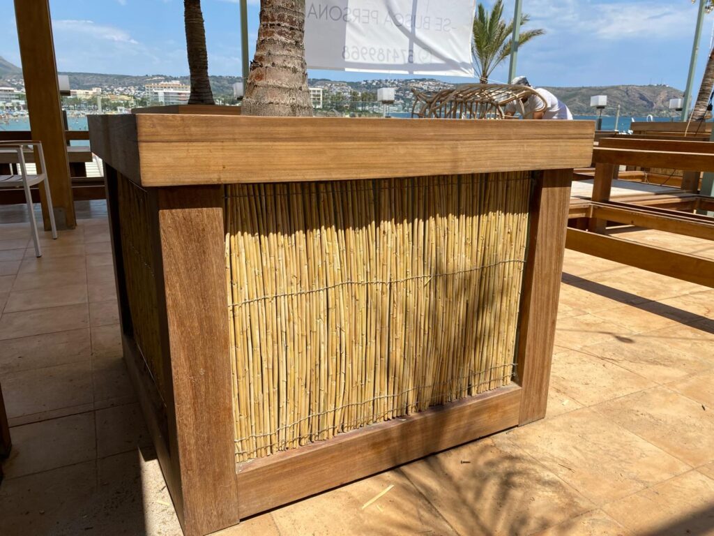 Restored iroko planter with new reed screening