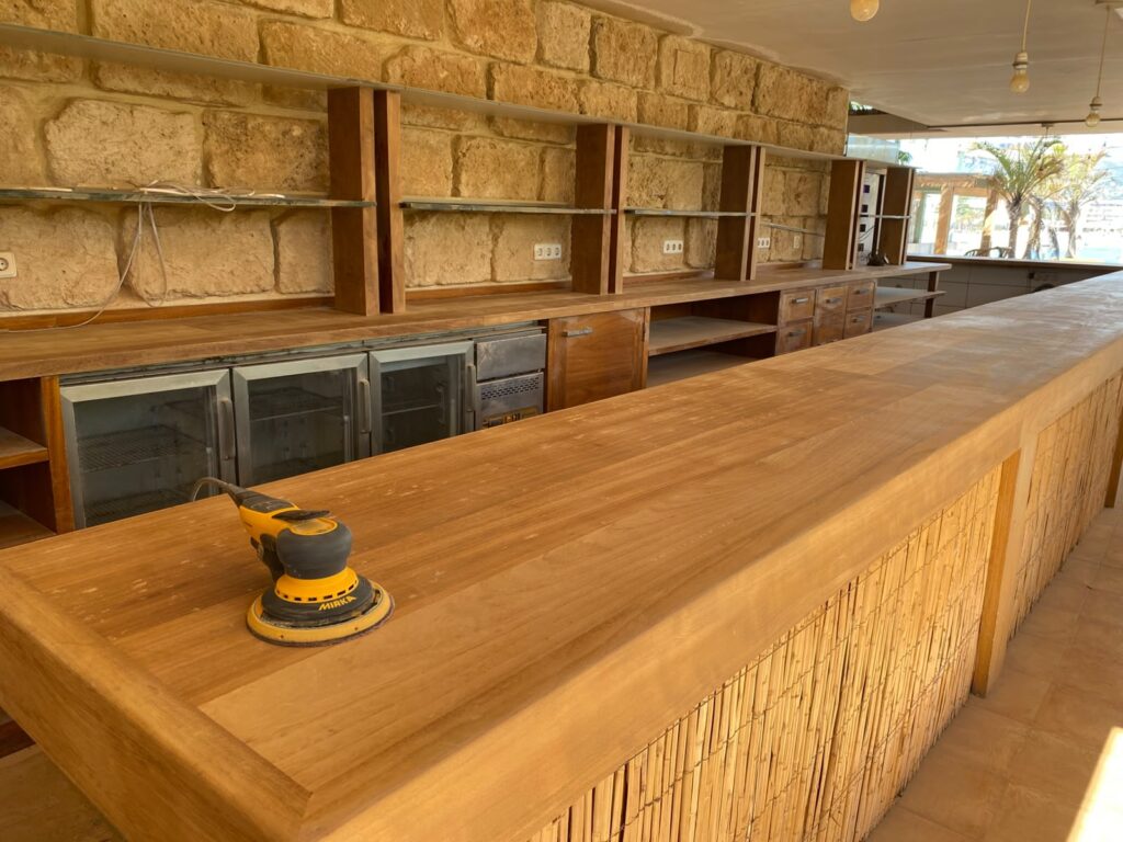 Restored iroko table top with smooth natural finish