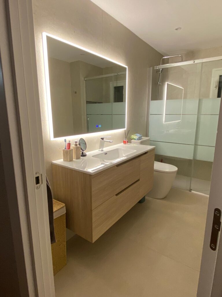 New walk-in shower with glass screen after bathroom renovation