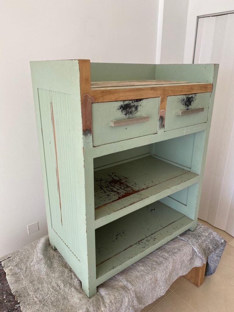 Green painted cabinet before restoration